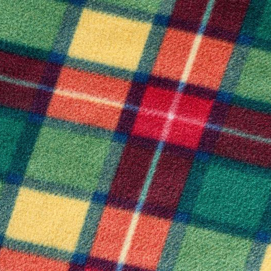 A close-up of the GIGSAK Giant red, yellow, green, and orange tartan fleece fabric