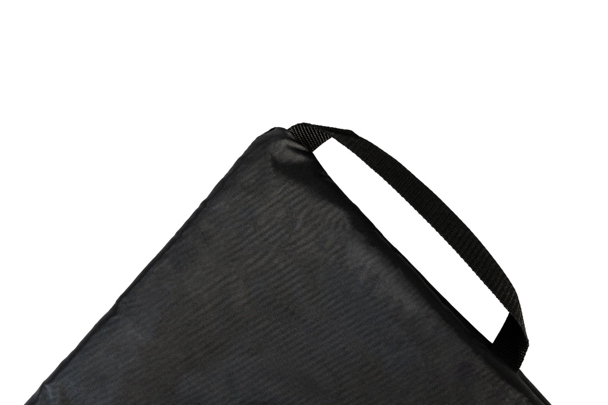 A GIGSAK outdoor waterproof blanket, the only outdoor waterproof blanket you can sit inside. It features a black waterproof layer and black internal handle to help in turing the GIGSAK inside out so you can sit inside. GIGSAK features a unique, hidden, cosy shelter to protect against the wind and rain. Simply turn GIGSAK inside out to stay warm and dry. GIGSAK is perfect for family picnics, BBQs, the beach, festivals, open-air cinema, fireworks, camping, and more.