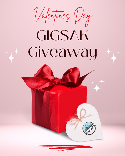 A red gift box with a red ribbon and a white heart tag with the GIGSAK logo. The text "Valentines Day GIGSAK Giveaway" is written above the box. Get ready to win big this Valentines Day! Check out the GIGSAK Giveaway for your chance to win a GIGSAK!