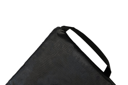 A GIGSAK outdoor waterproof blanket, the only outdoor waterproof blanket you can sit inside. It features a black waterproof layer and black internal handle to help in turing the GIGSAK inside out so you can sit inside. GIGSAK features a unique, hidden, cosy shelter to protect against the wind and rain. Simply turn GIGSAK inside out to stay warm and dry. GIGSAK is perfect for family picnics, BBQs, the beach, festivals, open-air cinema, fireworks, camping, and more.